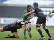 27 February 2011; Ian Keatley, Connacht, is tackled by Cai Griffiths and Justin Tipuric, Ospreys. Celtic League, Ospreys v Connacht, Liberty Stadium, Swansea, Wales. Picture credit: Steve Pope / SPORTSFILE