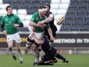 27 February 2011; Brian Tuohy, Connacht, gets the ball away despite the tackle of  Ian Gough and Rhys Webb, Ospreys. Celtic League, Ospreys v Connacht, Liberty Stadium, Swansea, Wales. Picture credit: Steve Pope / SPORTSFILE