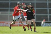 27 February 2011; Martin Moroney, Ardscoil Rís, in action against Mark O'Loughlin, left, and Ciaran Keogh, Charleville CBS. Dr. Harty Cup Final, Ardscoil Ris v Charleville CBS, Gaelic Grounds, Limerick. Picture credit: Diarmuid Greene / SPORTSFILE
