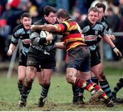 16 January 1999; Anthony Foley, Shannon, holds off the challenge of Colin McEntee, Lansdowne. AIB League Rugby, Shannon v Lansdowne, Clanwilliam RFC, Tipperary. Picture credit: Brendan Moran / SPORTSFILE
