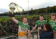 16 October 2016; Gary McFadden of Glenswilly holds aloft the Dr Maguire cup after the Donegal County Senior Club Football Championship Final game between Kilcar and Glenswilly at MacCumhaill Park in Ballybofey, Co. Donegal Photo by Oliver McVeigh/Sportsfile