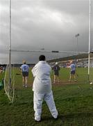 27 February 2011; An umpire keeps an eye on on the game. Walsh Cup Final, Dublin v Kilkenny, Parnell Park, Donnycarney, Dublin. Picture credit: Ray McManus / SPORTSFILE