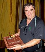 2 March 2011; Ireland manager Roy Torrens celebrates with a congratulatory cake after his side's victory over England. 2011 ICC Cricket World Cup, hosted by India, Sri Lanka and Bangladesh, Bangalore, India. Picture credit: Barry Chambers / Cricket Ireland / SPORTSFILE