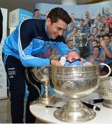 18 October 2016; AIG Insurance, proud sponsor of Dublin GAA, held a reception at its offices today to mark the Dublin football team’s All-Ireland success. Pictured is Bernard Brogan of Dublin with Emily Dunn, age 6 weeks, from Blackrock, Co Dublin. For more information about AIG Insurance’s products and services go to www.aig.ie or call 1890 50 27 27. AIG Offices in North Wall Quay, Dublin. Photo by Cody Glenn/Sportsfile