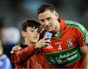 20 October 2016; Philly McMahon of  Ballymun Kickhams poses for a selfie with David Leonard, age 11, from Glasnevin, Co Dublin, after the Dublin County Senior Club Football Championship Quarter-Final match between Ballymun Kickhams and Raheny at Parnell Park in Dublin.  Photo by Sam Barnes/Sportsfile