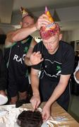 4 March 2011; Ireland's Kevin O'Brien cuts the cake to mark his 27th birthday as team-mate John Mooney helps adjust his party hat. 2011 ICC Cricket World Cup, hosted by India, Sri Lanka and Bangladesh, Bangalore, India. Picture credit: Barry Chambers / Cricket Ireland / SPORTSFILE