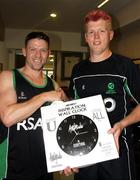 4 March 2011; Ireland's Kevin O'Brien, right, is presented with an Inspiration Wall Clock by team-mate Niall O'Brien to mark his 27th birthday. 2011 ICC Cricket World Cup, hosted by India, Sri Lanka and Bangladesh, Bangalore, India. Picture credit: Barry Chambers / Cricket Ireland / SPORTSFILE