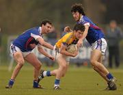 5 March 2011; Michael Brady, Colaiste Phadraig in action against Colm Coss, left, and Tommy Prendergast, WIT. Trench Cup Final, Colaiste Phadraig v WIT, New GAA, UCD, Belfield, Dublin. Photo by Sportsfile