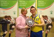5 March 2011; Ciaran Rattigan, Navan Arch Club, Meath, is presented with the shield by Bernie Priestley, Special Olympics, following his side's Men's Shield Final victory over COPE Foundation, Cork. Special Olympics Ireland National Basketball Cup, Loughlinstown Leisure Centre, Dun Laoghaire, Co. Dublin. Picture credit: Stephen McCarthy / SPORTSFILE