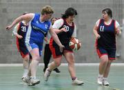 5 March 2011; Alison Dunleavy, Shooting Stars, supported by team-mate Monica O'Gorman is tackled by Maria Brennan, Waterford Special Olympics Clubs. Special Olympics Ireland National Basketball Cup, Loughlinstown Leisure Centre, Dun Laoghaire, Co. Dublin. Picture credit: Stephen McCarthy / SPORTSFILE