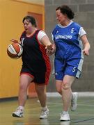 5 March 2011; Monica O'Gorman, Shooting Stars, in action against Caroline Power, Waterford Special Olympics Clubs. Special Olympics Ireland National Basketball Cup, Loughlinstown Leisure Centre, Dun Laoghaire, Co. Dublin. Picture credit: Stephen McCarthy / SPORTSFILE