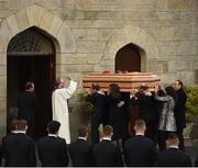 21 October 2016; Fr. Pat Malone blesses the coffin of Munster Rugby head coach Anthony Foley as it is carried in to St. Flannan’s Church, Killaloe, Co Clare. The Shannon club man, with whom he won 5 All Ireland League titles, played 202 times for Munster and was capped for Ireland 62 times, died suddenly in Paris on November 16, 2016 at the age of 42. Photo by Stephen McCarthy/Sportsfile