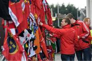 22 October 2016; Munster supporters read messages on flags, scarves and flowers placed outside the Shannon RFC Club house in memory of the late Munster Rugby head coach Anthony Foley before the European Rugby Champions Cup Pool 1 Round 2 match between Munster and Glasgow Warriors at Thomond Park in Limerick. The Shannon club man, with whom he won 5 All Ireland League titles, played 202 times for Munster and was capped for Ireland 62 times, who died suddenly in Paris on November 16, 2016 at the age of 42. Photo by Brendan Moran/Sportsfile