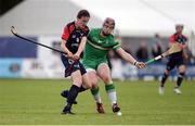 22 October 2016; Ryan McCambridge of Ireland in action against Innes Blackhall of Scotland during the 2016 U21 Hurling/Shinty International Series match between Ireland and Scotland at Bught Park in Inverness, Scotland. Photo by Piaras Ó Mídheach/Sportsfile