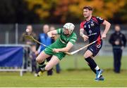 22 October 2016; Damien Healy of Ireland in action against Thomas Borthwick of Scotland during the 2016 Senior Hurling/Shinty International Series match between Ireland and Scotland at Bught Park in Inverness, Scotland. Photo by Piaras Ó Mídheach/Sportsfile