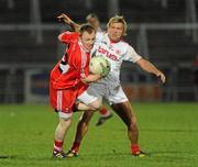 5 March 2011; Martin Donaghy, Derry, in action against Owen Mulligan, Tyrone. Barrett Sports Lighting Dr. McKenna Cup Final, Tyrone v Derry, Athletic Grounds, Armagh. Picture credit: Oliver McVeigh / SPORTSFILE
