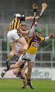 6 March 2011; T.J. Reid, Kilkenny, in action against Tomas Waters, right, and Lar Prendergast, Wexford. Allianz Hurling League Division 1 Round 3, Kilkenny v Wexford, Nowlan Park, Kilkenny. Picture credit: Stephen McCarthy / SPORTSFILE