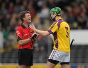6 March 2011; Referee Tony Carroll, Offaly, shares a laugh with Matthew O'Hanlon, Wexford, before issuing him with a yellow card. Allianz Hurling League Division 1 Round 3, Kilkenny v Wexford, Nowlan Park, Kilkenny. Picture credit: Stephen McCarthy / SPORTSFILE