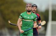 22 October 2016; Gerry Keegan of Ireland is marked by Daniel Cameron of Scotland during the 2016 Senior Hurling/Shinty International Series match between Ireland and Scotland at Bught Park in Inverness, Scotland. Photo by Piaras Ó Mídheach/Sportsfile