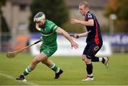 22 October 2016; Mickey Burke of Ireland in action against Kevin Bartlett of Scotland during the 2016 Senior Hurling/Shinty International Series match between Ireland and Scotland at Bught Park in Inverness, Scotland. Photo by Piaras Ó Mídheach/Sportsfile