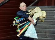 22 October 2016; Ireland kitman Tommy Byrne brings gear to the pitch prior to the 2016 U21 Hurling/Shinty International Series match between Ireland and Scotland at Bught Park in Inverness, Scotland. Photo by Piaras Ó Mídheach/Sportsfile