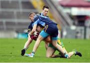 23 October 2016; Daithi Burke of Corofin is tackled by Barry Kelly, and Robert Butler, 10, of Salthill-Knocknacarra during the Galway County Senior Club Football Championship Final match between Corofin and Salthill-Knocknacarra at Pearse Stadium in Galway. Photo by Ramsey Cardy/Sportsfile