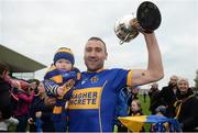 23 October 2016; Garry Kelly of St Rynagh's celebrates with his son Archie Kelly, age 8 months, following the Offaly County Senior Club Hurling Championship Final game between St Rynagh's and Birr at O'Connor Park in Tullamore, Co Offaly. Photo by Cody Glenn/Sportsfile