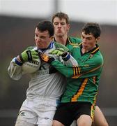 12 January 2011; Dean McNicholas, left, Colaiste Mhuire Mullingar in action against Stephen Fitzsimmons, centre, and Karl McGrath, right, St. Benildus College. Leinster Colleges Senior Football A Championship Round 1, Colaiste Mhuire Mullingar v St. Benildus College, St. Loman's GAA Club, Lakepoint Park, Mullingar, Co. Westmeath. Picture credit: Barry Cregg / SPORTSFILE