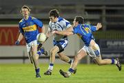 9 March 2011; Tadhg Houlihan, Waterford, in action against Billy Hewitt, and Aldo Matassa, left, Tipperary. Cadbury Munster GAA Football Under 21 Championship Quarter-Final, Waterford v Tipperary, Fraher Field, Dungarvan, Co. Waterford. Picture credit: Diarmuid Greene / SPORTSFILE