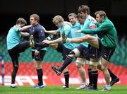 11 March 2011; Ireland's players, from left to right, Ronan O'Gara, Sean Cronin, Andrew Trimble, Sean O'Brien, Denis Leamy, Donncha O'Callaghan and Tommy Bowe, do some stretches, during the squad captain's run ahead of their RBS Six Nations Rugby Championship match against Wales on Saturday. Ireland Rugby Squad Captain's Run, Millennium Stadium, Cardiff, Wales. Picture credit: Matt Browne / SPORTSFILE