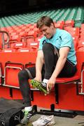 11 March 2011; Ireland's Ronan O'Gara puts on his boots ahead of the squad captain's run ahead of their RBS Six Nations Rugby Championship match against Wales on Saturday. Ireland Rugby Squad Captain's Run, Millennium Stadium, Cardiff, Wales. Picture credit: Barry Cregg / SPORTSFILE