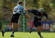 27 October 2001; Shane Moore of UCD is tackled by Mervyn Murphy of Galwegians during the AIB League Division 1 match between UCD and Galwegians at Belfield Bowl in Dublin. Photo by Ray McManus/Sportsfile