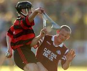 28 October 2001; Billy O'Sullivan of Ballygunner, is tackled by Dara O'Driscoll of St Joseph's Doora Barefield during the AIB Munster Senior Club Hurling Championship Quarter-Final match between Ballygunner and St Joseph's Doora Barefield at Walsh Park in Waterford. Photo by Ray McManus/Sportsfile