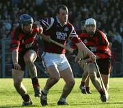 28 October 2001; Ollie Baker of St Joseph's Doora Barefield, under pressure from Andy Moloney, left, and Alan Kinwan, both of Ballygunner, during the AIB Munster Senior Club Hurling Championship Quarter-Final match between Ballygunner and St Joseph's Doora Barefield at Walsh Park in Waterford. Photo by Ray McManus/Sportsfile