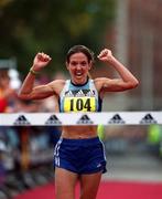 29 October 2001; Debbie Robinson celebrates as she crosses the finish line to be first woman home in the adidas Dublin Marathon 2001 in Dublin. Photo by Ray McManus/Sportsfile