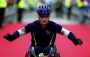 29 October 2001; Kenny Herriot, Scotland, crosses the finish line to win the wheelchair event of the adidas Dublin Marathon 2001. Photo by Ray McManus/Sportsfile