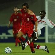 31 October 2001; Ali Karimi of Iran in action against Fahed Masoud Ali Masound of United Arab Emirates during the 2002 FIFA World Cup AFC Qualification Play-Off 2nd Leg match between United Arab Emirates and Iran the at Al-Nahyan Stadium in Abu Dhabi, United Arab Emirates. Photo by David Maher/Sportsfile