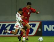 31 October 2001; Ali Daei of Iran in action against Mohammed Qassim Juma of United Arab Emirates during the 2002 FIFA World Cup AFC Qualification Play-Off 2nd Leg match between United Arab Emirates and Iran the at Al-Nahyan Stadium in Abu Dhabi, United Arab Emirates. Photo by David Maher/Sportsfile