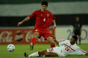 31 October 2001; Kharim Bagheri of Iran in action against Sibait Khater Fayel of United Arab Emirates during the 2002 FIFA World Cup AFC Qualification Play-Off 2nd Leg match between United Arab Emirates and Iran the at Al-Nahyan Stadium in Abu Dhabi, United Arab Emirates. Photo by David Maher/Sportsfile