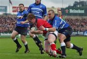 3 November 2001; Anthony Horgan of Munster crosses the line to score his side's first try despite the tackle of Gareth Jones of Bridgend during the Heineken Cup Pool 4 Round 4 match between Munster and Bridgend at Musgrave Park in Cork. Photo by Brendan Moran/Sportsfile