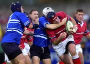 3 November 2001; Anthony Foley of Munster is tackled by Craig Warlo, centre, and Jamie Ringer, left, both of Bridgend, during the Heineken Cup Pool 4 Round 4 match between Munster and Bridgend at Musgrave Park in Cork. Photo by Brendan Moran/Sportsfile