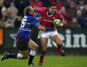 3 November 2001; Jeremy Staunton of Munster is tackled by Gareth Thomas of Bridgend during the Heineken Cup Pool 4 Round 4 match between Munster and Bridgend at Musgrave Park in Cork. Photo by Brendan Moran/Sportsfile