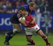 3 November 2001; Jason Holland of Munster is tackled by Gareth Thomas of Bridgend during the Heineken Cup Pool 4 Round 4 match between Munster and Bridgend at Musgrave Park in Cork. Photo by Brendan Moran/Sportsfile