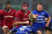 3 November 2001; Anthony Foley of Munster is tackled by Gareth Williams of Bridgend during the Heineken Cup Pool 4 Round 4 match between Munster and Bridgend at Musgrave Park in Cork. Photo by Brendan Moran/Sportsfile