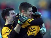 5 November 2001;  Dunshaughlin players, Denis Kealy, left, Feral Gogan, centre, and Ciaran Byrne celebrate at the final whistle following the Meath County Football Final match between Dunshaughlin and Skryne at Pairc Tailteann in Navan, Meath. Photo by Aofie Rice/Sportsfile