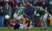 4 November 2001; Paul Noone of Roscommon Gaels clears under pressure from Mark Caffrey, left, and Aidan Higgins, both of Charlestown Sarsfields during the AIB Connacht Club Senior Football Championship Semi-final match between Charlestown Sarsfields and Roscommon Gaels at Fr O'Hara Memorial Park in Charlestown, Mayo. Photo by Ray McManus/Sportsfile