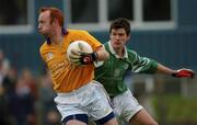 4 November 2001; Roscommon Gaels' goalkeeper Enda Daly clears under pressure from Aidan higgins of Charlestown Sarsfields during the AIB Connacht Club Senior Football Championship Semi-final match between Charlestown Sarsfields and Roscommon Gaels at Fr O'Hara Memorial Park in Charlestown, Mayo. Photo by Ray McManus/Sportsfile