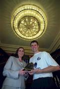 7 November 2001; Majella Fitzpatrick, eircom Public Relations Manager, presents Niall Quinn of Republic of Ireland, with a specially commissioned bronze boot in recognition of him becoming the record Irish goalscorer of all time. The presentation took place at City West Hotel in Saggart, Dublin. Photo by Brendan Moran/Sportsfile
