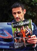 7 October 2001; Peter Mathews reads a copy of Irish Runner ahead of the Rathfarnham 5K in Rathfarnham, Dublin. Photo by Ronnie McGarry/Sportsfile