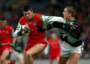 10 November 2001; Aodán Mac Gearailt of An Ghaeltacht in action against Niall Geary of Nemo Rangers during the AIB Munster Club Senior Football Championship Semi-final match between Nemo Rangers and An Ghaeltacht at Pairc Uí Chaoimh in Cork. Photo by Ray McManus/Sportsfile